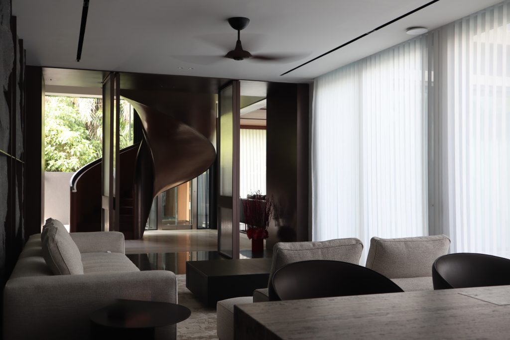 Living room with elegant sheer curtains at the window.